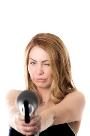 Woman Pointing a Hair Dryer
