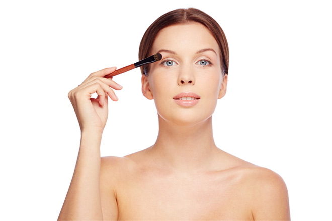 Beautiful Woman Applying Makeup