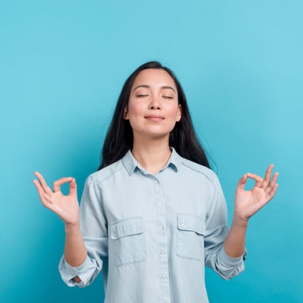 Happy Woman doing breathing exercises.