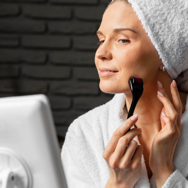 Woman during her morning skincare routine.